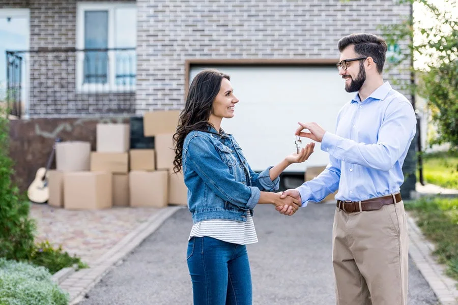 New homeowner receiving keys after closing